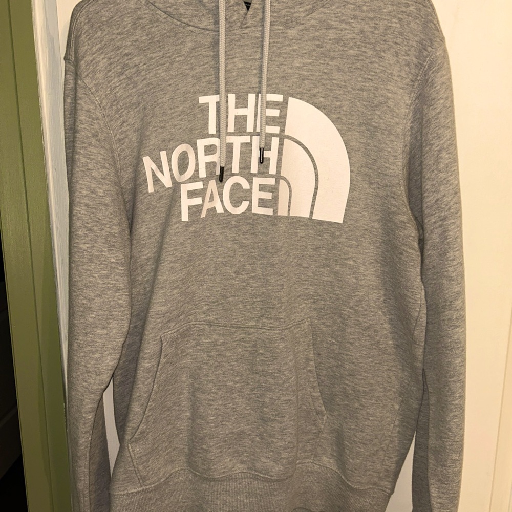 Men’s size small The North Face hooded pull over sweatshirt .